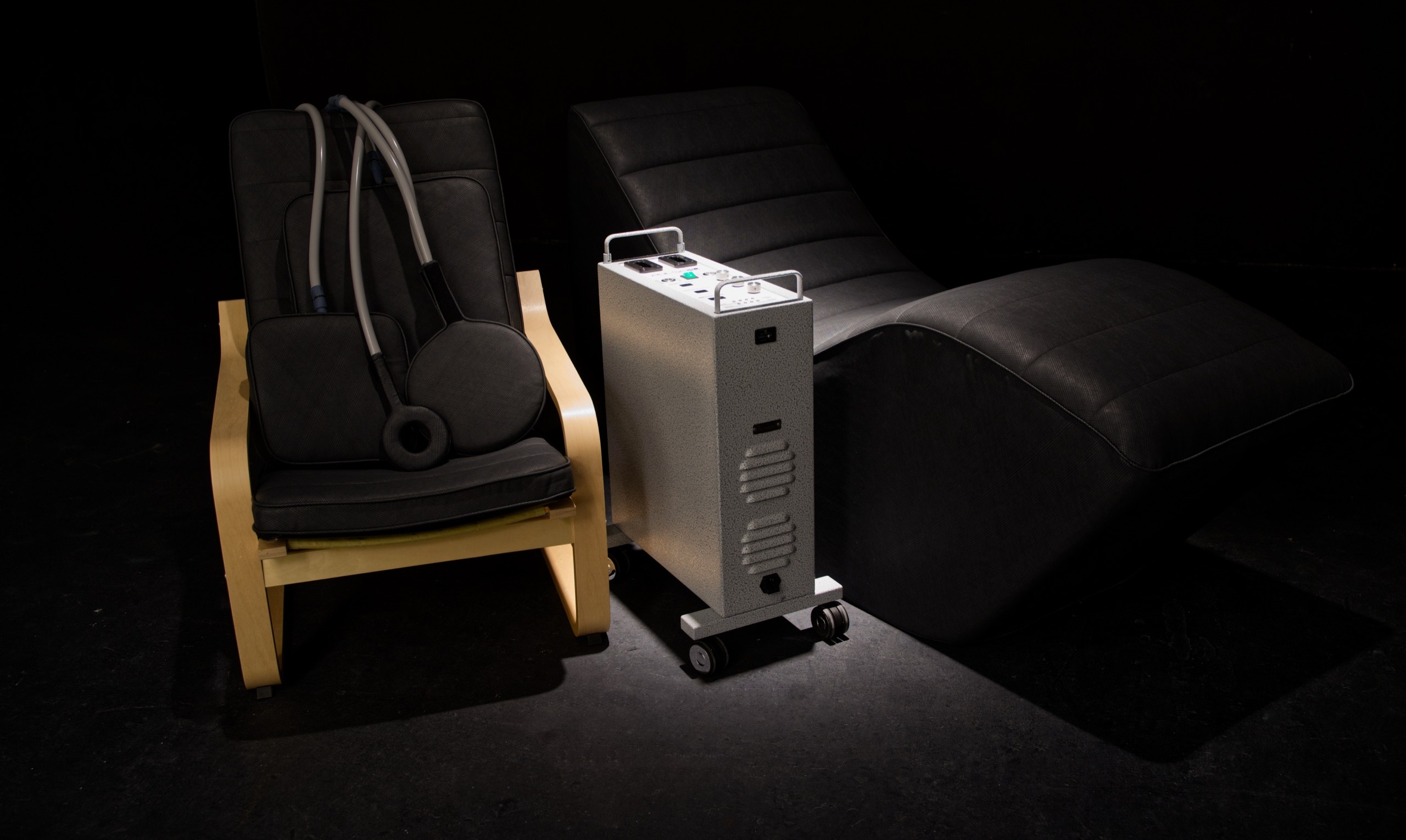 Pulse PEMF chair and zero-gravity chaise flanking the pearl-white Pulse XL Pro, in low dramatic light