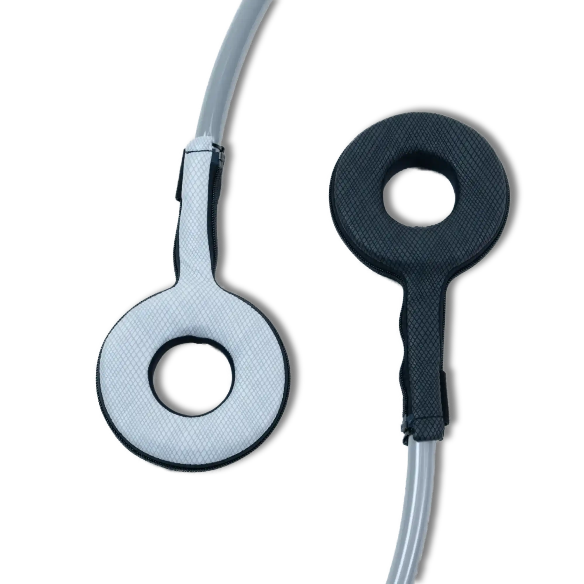 Two Pulse PEMF Power Ring accessories on a white background, one in white and one in black, each a padded ring-shaped applicator with a center opening and a zippered textured cover, attached to a gray cable.