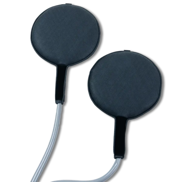 Two Pulse PEMF round paddle accessories in dark navy textured fabric, each a padded circular disc with a short black handle and attached gray cable, on a white background.